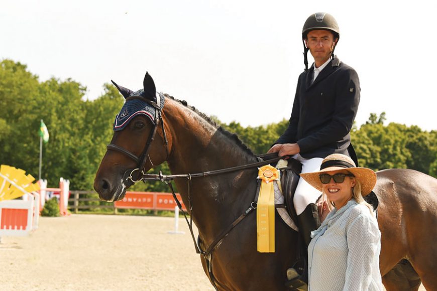 Christian Coyle with wife Chelsea Dwinell, marketing and sales manager for Old Salem Farm, after taking third prize in the Grand Prix of Old Salem Farm’s Summer Jumper Classic last year. Photograph by Sarah Latterner.