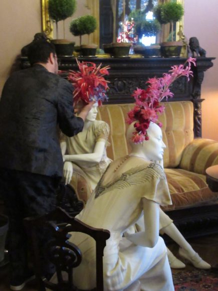 Joshua Werber installs his floral headpieces as the April 5 Preview Party gets under way at the Lyndhurst Flower Show in Tarrytown. Photograph by Mary Shustack.