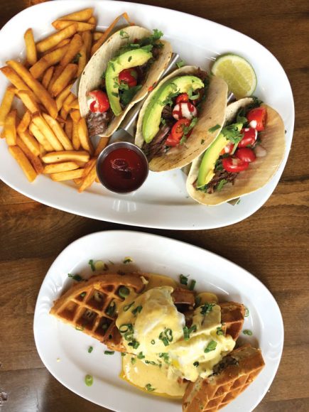 A trio of brisket tacos, left,  and mushroom waffles topped with poached eggs. Photograph by Aleesia Forni.