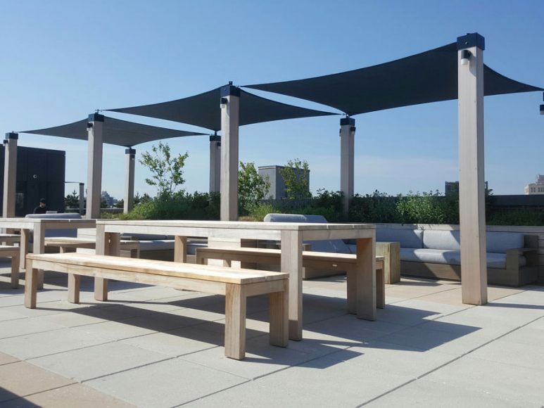Shade sails provide elegant-looking sun protection on this rooftop in Brooklyn. Courtesy Gregory Sahagian & Son.