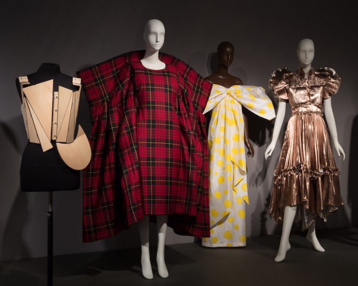 An introductory platform highlighting minimal and maximal looks in the Fashion and Textile History Gallery of The Museum at FIT, where “Minimalism/Maximalism” continues through Nov. 16. Photograph © The Museum at FIT.