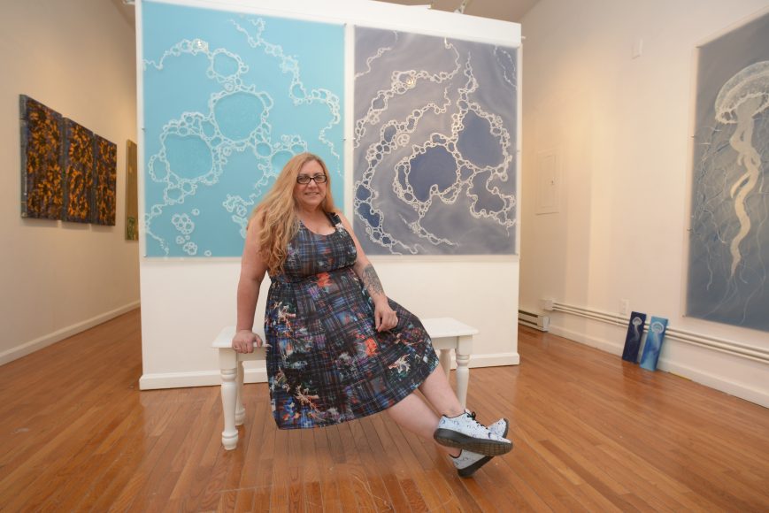 Carla Goldberg pictured within “Ten Years Gone,” an exhibition of her work that continues through July 7 at 
BAU gallery in Beacon. Photograph by Bob Rozycki.