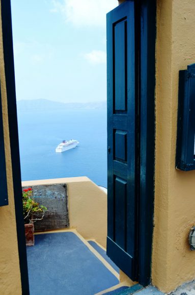 A door on the island of Santorini opens onto a ship and a world of adventure.