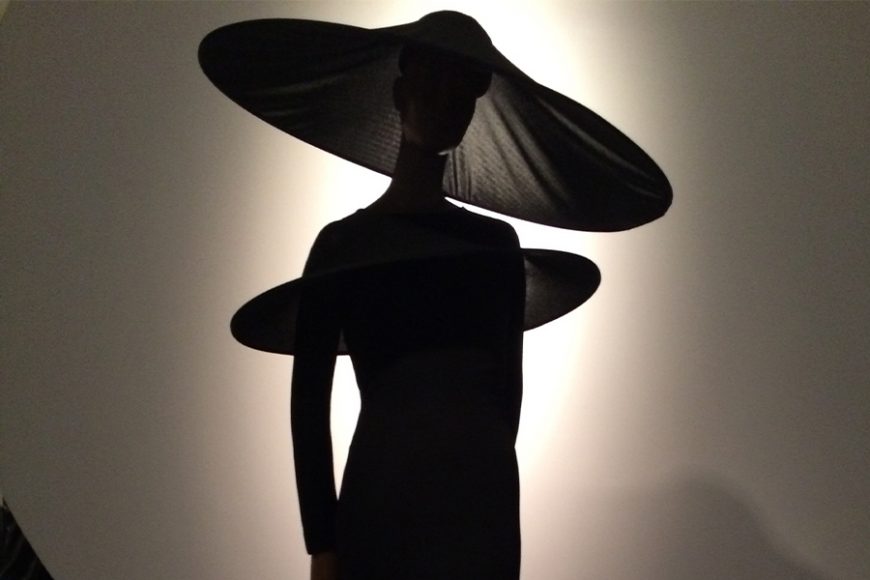 A 1991 Pierre Cardin evening ensemble featuring a dress with “Parabolic” shoulders and hat creates a dramatic silhouette, as featured in “Pierre Cardin: Future Fashion” at the Brooklyn Museum. Photograph by Mary Shustack.