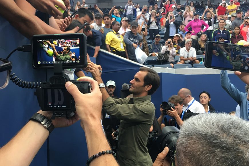 The always crisp Roger Federer signs autographs for fans after meeting the press on the US Open’s Media Day at the Louis Armstrong Stadium. Photographs by Georgette Gouveia.