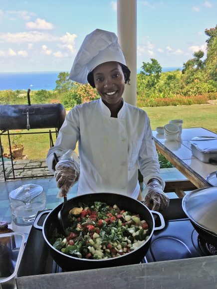 Chef Irie  taught our Wanderers Debbi and William Kickham how to make jerk chicken. Bring out the Red Stripe beer. Photograph by Debbi K. Kickham.