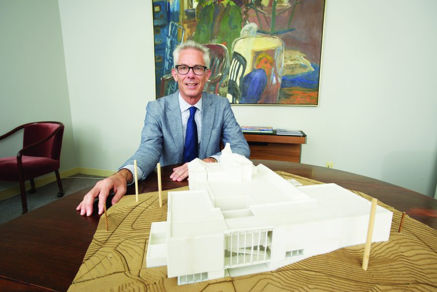 Robert Wolterstorff with a model of what the Bruce Museum will look like following renovations. Photograph by Bob Rozycki