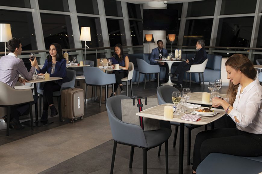 Air France air 
travelers flying from 
John F. Kennedy International Airport in Queens to Paris opt for the night service of dinner in the lounge so they can sleep throughout their night flight.