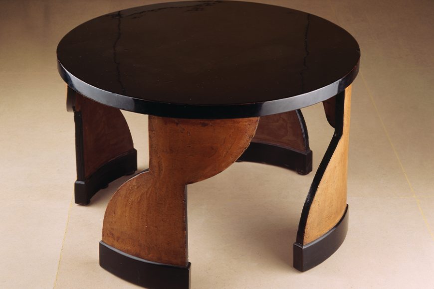 Eileen Gray. “Pedestal table,” 1922-25. Carved and lacquered oak. Private collection. Image courtesy Galerie Vallois, Paris. Photographed by Arnaud Capentier.