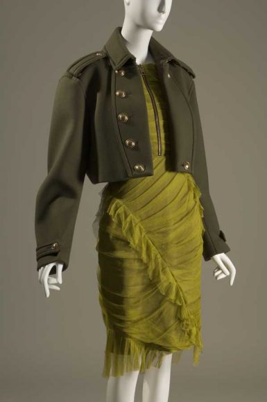 Burberry, ensemble, green net, green wool, and black leather, fall 2010, England, Gift of Burberry. Courtesy The Museum at FIT.