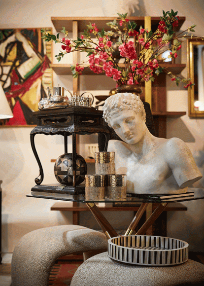 A marvelous Grecian bust graces part of Pamela Frisoli’s Trovare Home booth at “The Greenwich Winter Antiques Show.” Photograph by Elaine Ubiña. 