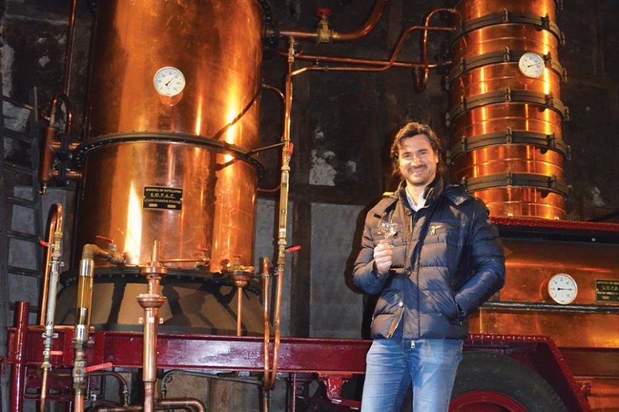 Remy Grassa of Domaine Tariquet in front one of his Armagnac distillers. Photograph by Doug Paulding.