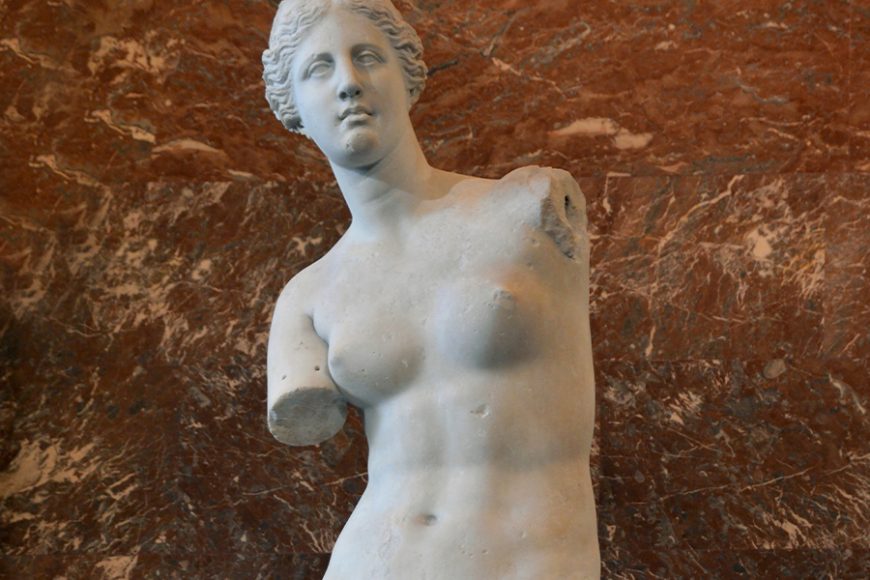 Alexandros of Antioch’s Aphrodite of Melos, otherwise known as the Venus de Milo (130-100 B.C.) marble. Musée du Louvre. She offers a standard of beauty that includes a flat but shapely torso.