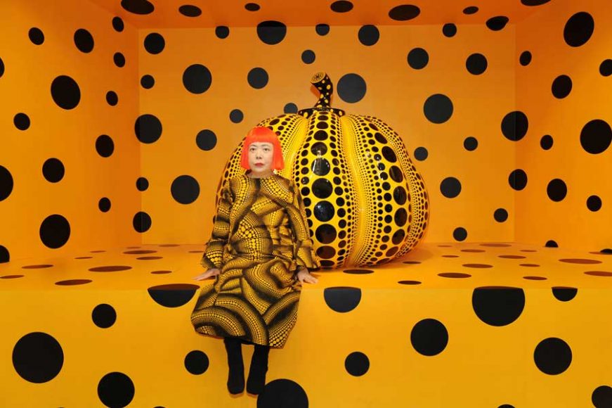 Kusama with “Pumpkin” (2010) ©Yayoi Kusama. Courtesy of Ota Fine Arts, Tokyo / Singapore / Shanghai; Victoria Miro, London; David Zwirner, New York.