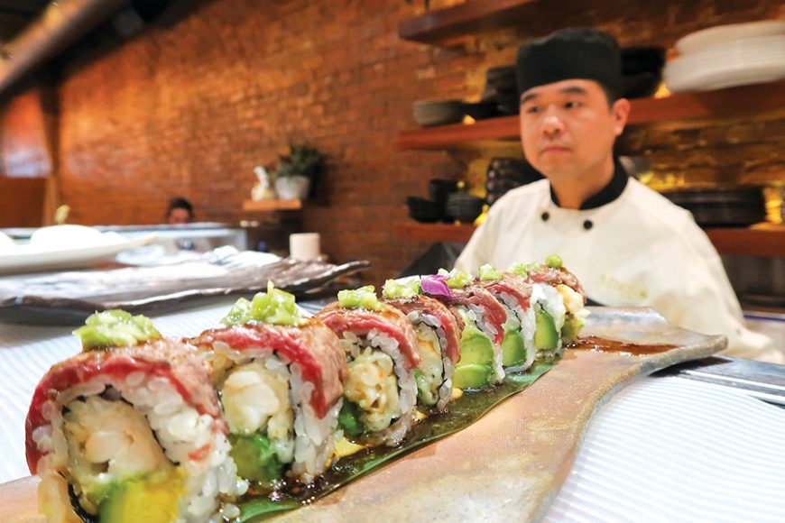 Sushi Chef Steve Chen with a lighthouse roll at Miku. Photographs by Sarah Bamford. 