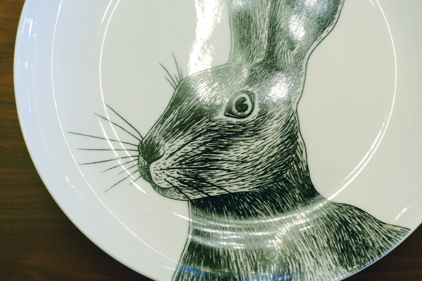 A bunny peers out from a plate at The Tailored Home.