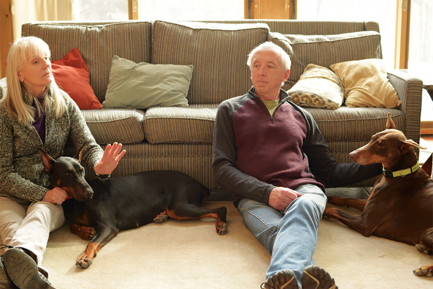 Karen and Bob Madden at home with their two Dobermans. Photographs by Bob Rozycki.
