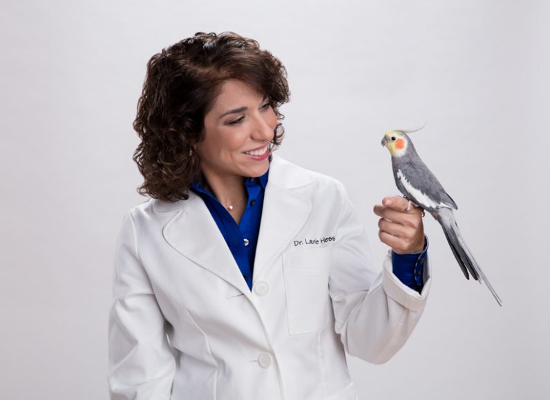 Laurie Hess, D.V.M., with a cockatiel. Courtesy ZuPreem