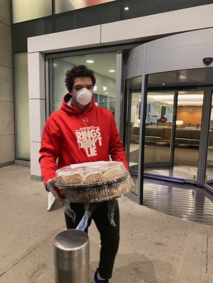 John Prince delivering meals to workers at an area hospital as part of a successful campaign that he and two friends ran during the height of the pandemic. 