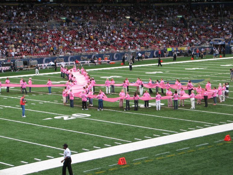 On Oct. 7, 2007, 100 breast cancer survivors made a huge crossed pink ribbon, the breast cancer awareness symbol, on a football field. This year’s celebrations, commemorations and other fundraising events will look different, because of the challenge of the virus.