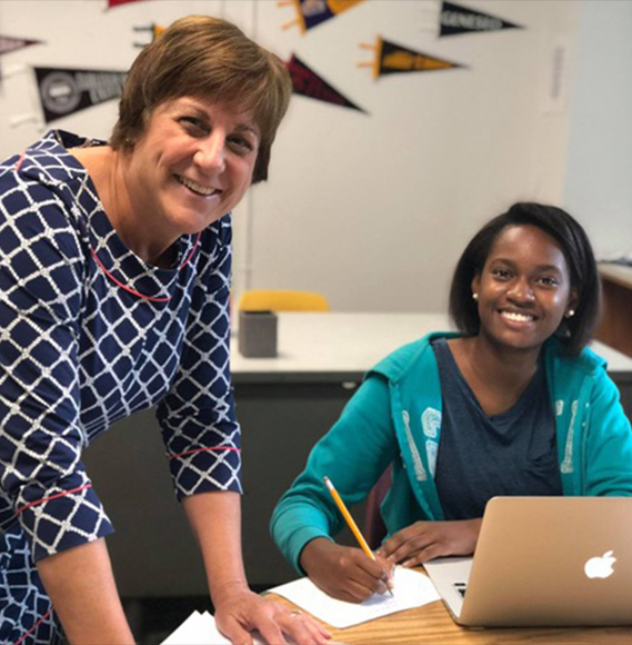 Destination: College director of college/access and retention Linda D’Arcy working with Mount Vernon High School student Rachel Mojica.  Courtesy Destination: College.