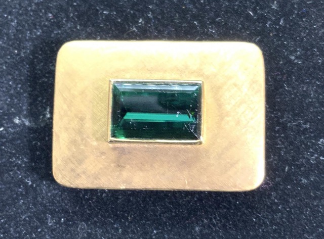 Modernist offerings include this signed Roberto Burle Marx tourmaline brooch ($800/3,500) in brushed 18-karat yellow gold, measuring 1¾ by 1¼ inches. Photographs courtesy The Benefit Shop Foundation.