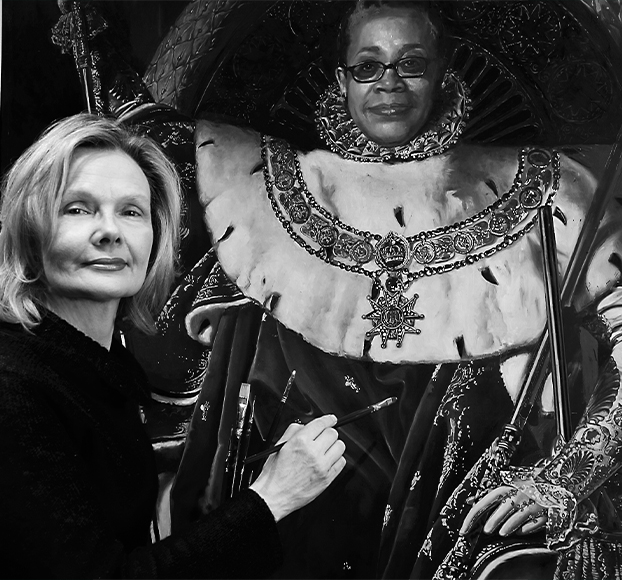 Kathleen Gilje before her “Lowery Sims as Ingres’ Napoleon With a Gun” (2006, oil on linen), in which she pays tribute to Lowery Stokes Sims, curator emerita of Manhattan’s Museum of Arts and Design, by taking inspiration from Jean-Antoine-Dominique Ingres’ “Napoleon I on the Throne” (1806, oil on canvas) and Eldridge Cleaver’s 1967 photograph “Untitled: Huey P. Newton in a Wicker Peacock Chair.”