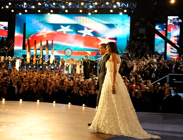 President Barack Obama and first lady Michelle Obama arrive at the Neighborhood Ball in downtown Washington, D.C., Jan. 20, 2009. Michelle Obama's goddess gown caused a sensation that put designer Jason Wu on the map. Photograph by Tech Sgt. Suzanne Day.