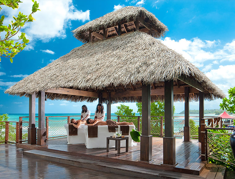 Sandals' Red Lane Spa offers sybaritic outdoor spa treatments under a sun-kissed palapa. Courtesy Sandals Resorts.