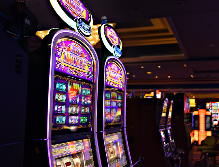 Slot Machines. Photograph by Steve Sawusch on Upsplash.