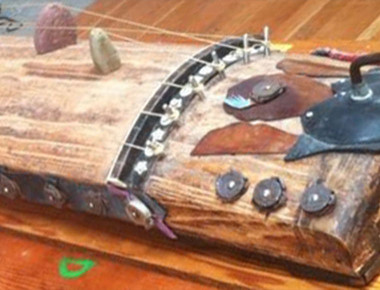 Guillermo Galindo’s “Huesocordio” (2012), vertebrae bridges, wood box resonator, nylon strings and pick-up amplification. Courtesy Hudson River Museum.