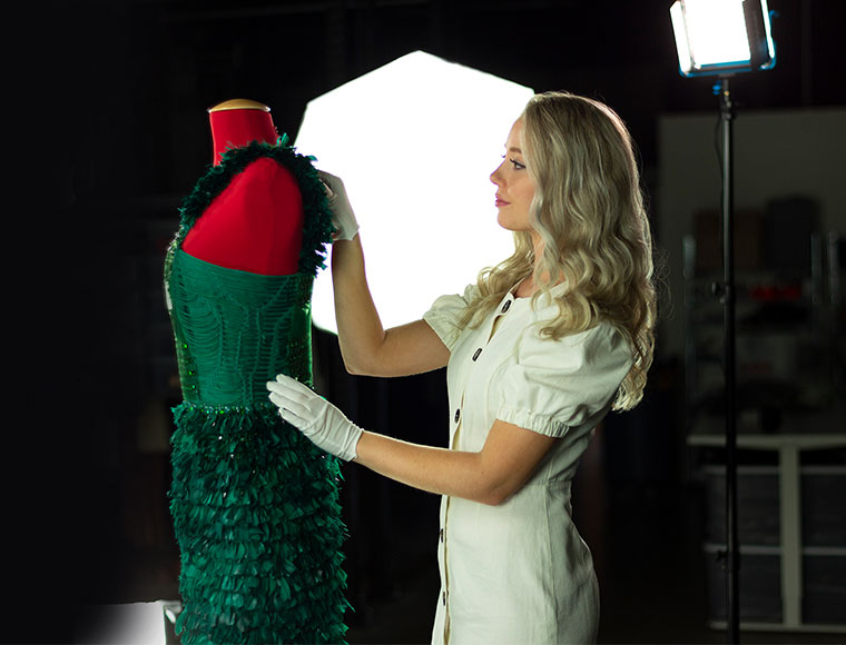 A Garde Robe wardrobe manager prepares a garment to be photographed professionally in the studio. Coutesy Garde Robe.