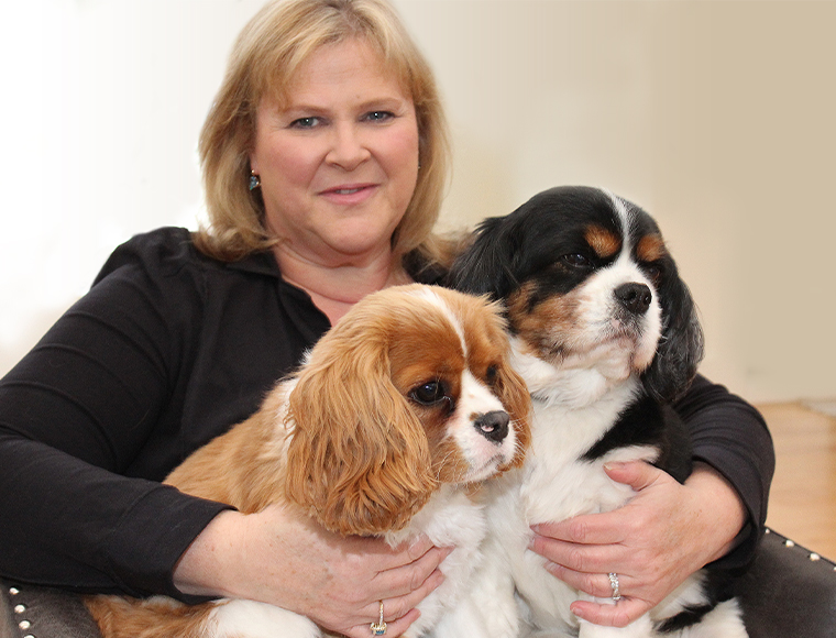 Gwen Sherman, D.V.M, with Cavalier King Charles Spaniels Rikki, left, and Levi. 