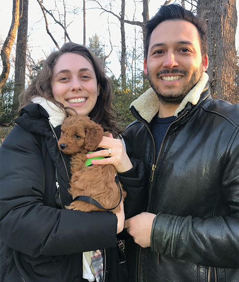 “Puppy love”: The author’s son, Gregory Weinstein, proposed to Michaela Pavia by tying the ring to their Doodle puppy Franklin’s collar. Courtesy Cami Weinstein.