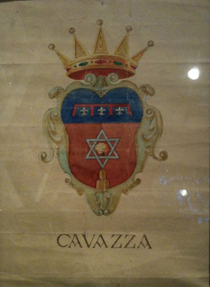 The Cavazzi family crest. (The name was changed from Cavazza, seen here, to Cavazzi at Ellis Island when family members immigrated to the United States.) The hexagonal star (a common symbol and no connection to Judaism in this case) sits above a pendulum signifying equity, Steve Cavazzi says. The three pillars below it represent the three sons of King Manfred (1232-66), son of Holy Roman Emperor Frederick II, who ruled over Sicily during a tumultuous time and was known for his graciousness, generosity, good looks and intellectual abilities.