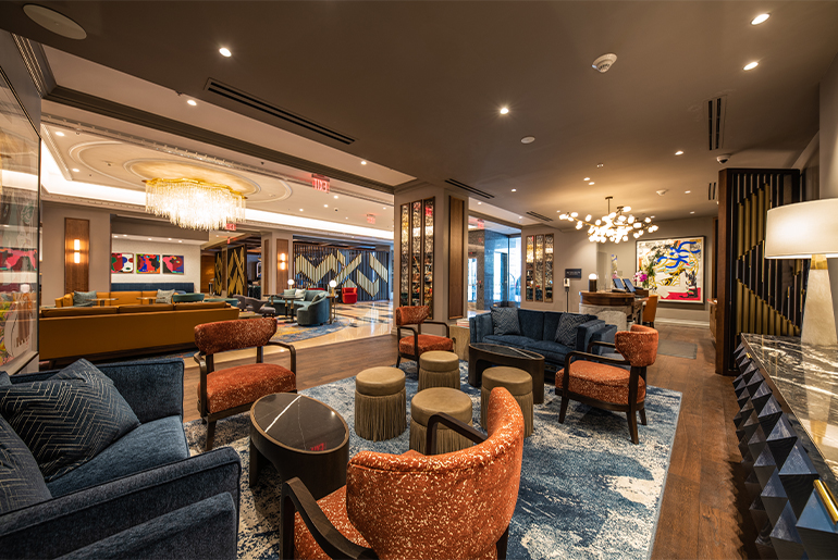 The lobby lounge of The Opus Westchester in White Plains, whose interiors have been given a mid-century modern take by Manhattan’s Celano Design Studio. Note the pipe-organ decoration, which underscores the hotel’s musical motif. Courtesy The Opus Westchester.