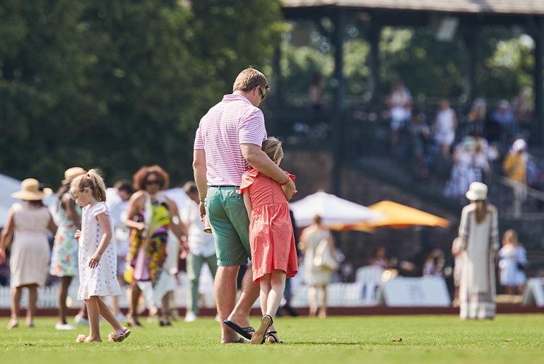 A father and daughter share a sweet moment together during the stomping of the divots at halftime at a Greenwich Polo Club match, an ideal way to spend Father’s Day. Courtesy Greenwich Polo Club.
