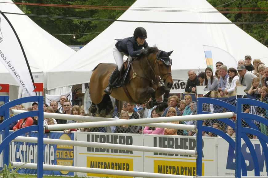 Jessica Springsteen – seen here aboard Vindicat W in Wiesbaden, Germany, in 2013 – is making her Olympic debut at the Tokyo Games, which begin Monday, July 12.