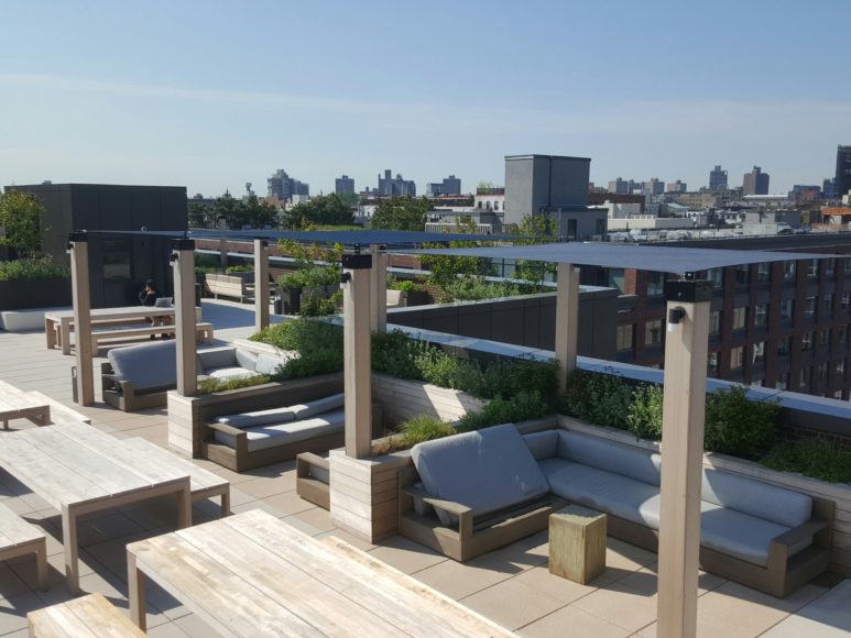 A trending rooftop shade sail offers a respite from the sun in Brooklyn. Photographs courtesy Gregory Sahagian & Son Inc.