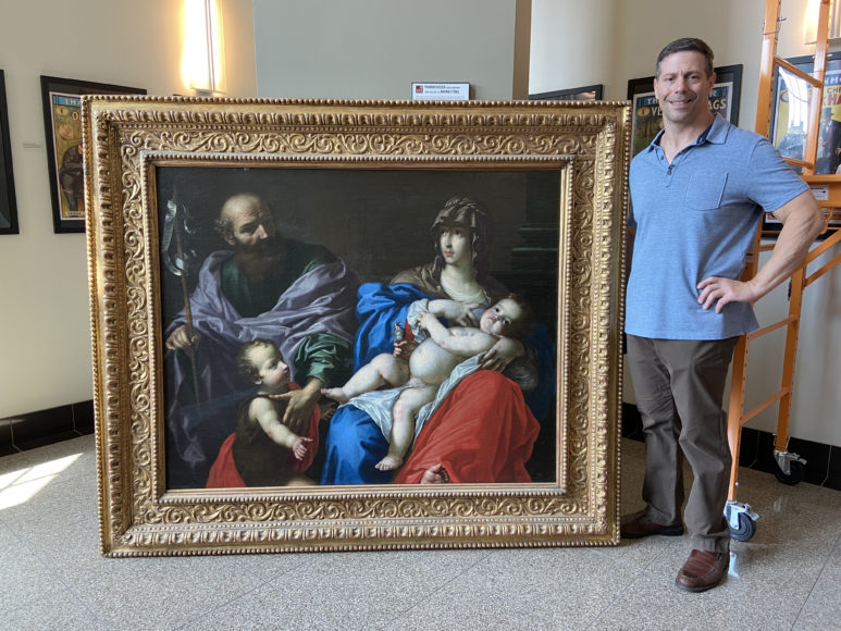 Iona College visual arts professor and art historian Thomas Ruggio with a painting attributed to Cesare Dandini, a painting attributed to Cesare Dandini is on display at Iona College’s Ryan Library. Photograph courtesy Iona College.