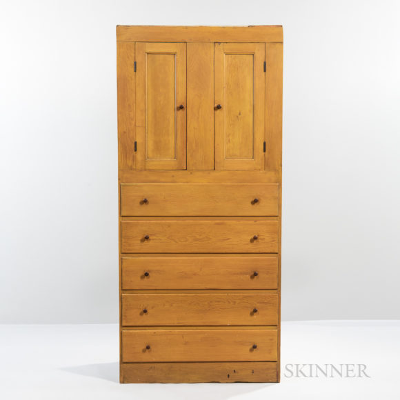 This Shaker yellow-painted cupboard over drawers offered clean lines, ample storage and careful construction. Form follows function years before those words became a catchphrase. Sold for $9,375 at Skinner Inc.
