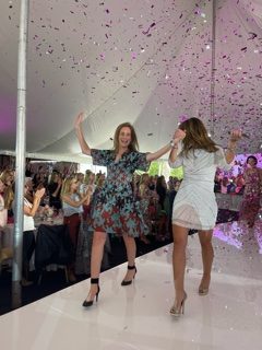 Meg Russell, BCA rresident, and Yonni Wattenmaker, BCA executive director, as Mylar pink and silver confetti rained down for the finale of the Breast Cancer Alliance Luncheon at the Westchester Country Club Oct. 20.