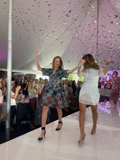 Meg Russell, BCA rresident, and Yonni Wattenmaker, BCA executive director, as Mylar pink and silver confetti rained down for the finale of the Breast Cancer Alliance Luncheon at the Westchester Country Club Oct. 20.