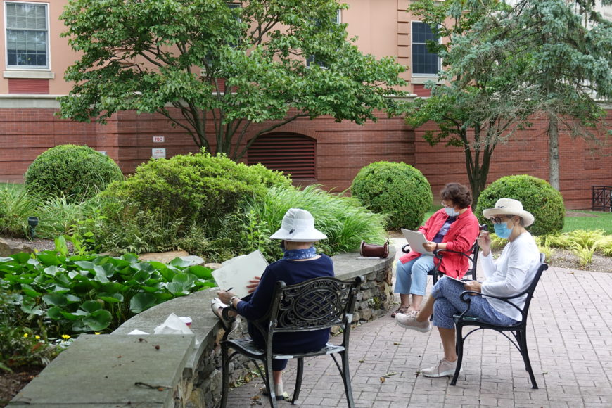 Residents engage in plein air painting.
