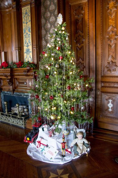 A decorated tree and conservatory pointsettias enhance the holiday season at the Second Empire-style manse, built in 1864-68 for railroad and banking magnate LeGrand Lockwood. Courtesy Sarah Grote Photography.
The Grand Staircase sweeps you up to a Christmas tree at holiday time. Photograph by Alex Rosenfeld.