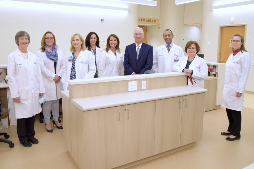 Saint Joseph’s Medical Center President and CEO Michael Spicer with a group of board-certified physicians at the hospital’s Family Health Center in Yonkers.