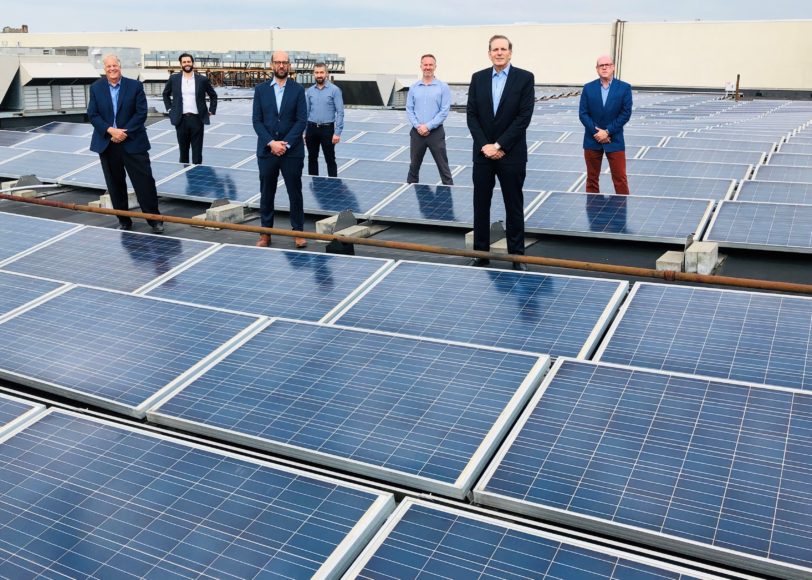 At a solar installation in Port Chester. Left front: John Faltings, president of G&S Solar; Abe Naparstek, COO, G&S Solar; Greg Berger, president of RMC. Left back: David Katz, senior director, renewable energy, G&S Solar; Jeremy Frank; Damian Finley, vice president of construction and development, RMC and Laurence Gottlieb, managing director, RMC Bio1. The team is  aiding sustainability in Yonkers. 