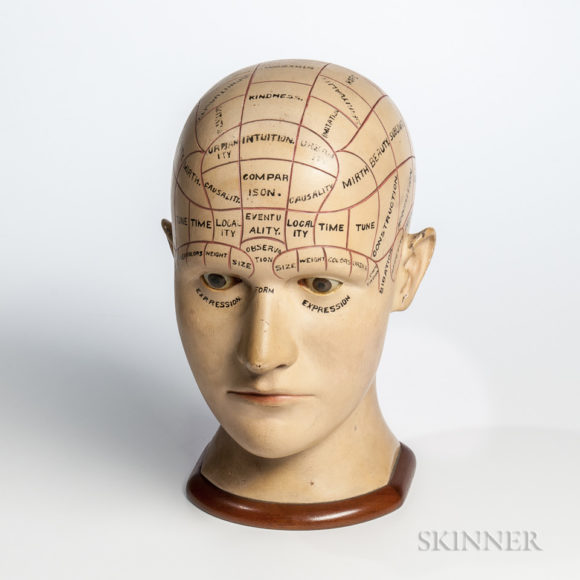 Carved Wood Phrenology Head, New England, a life-size, painted and carved wood bust with incised labeled regions of the cranium and eyes painted brown, mounted to a mahogany cove-molded base (height 12 inches). Sold by Hill Gallery, Birmingham, Michigan, to a private Massachusetts collector. Recently sold at auction by Skinner Inc. for $5,535.