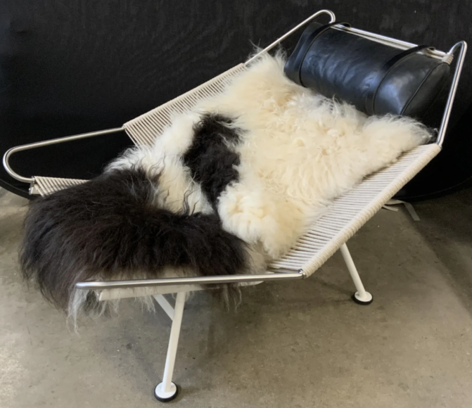 This Hans Wegner for PP Mobler halyard lounge chair ($500 to $2,000) has a white, lacquered and steel base with a plaited halyard seat and back. The sheepskin cushion is included. 