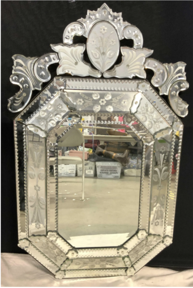 This 49-inch vintage Venetian glass wall mirror ($100 to $500) features beveled glass panels in an octagonal shape. 